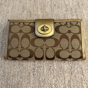 Coach gold turnlock long wallet